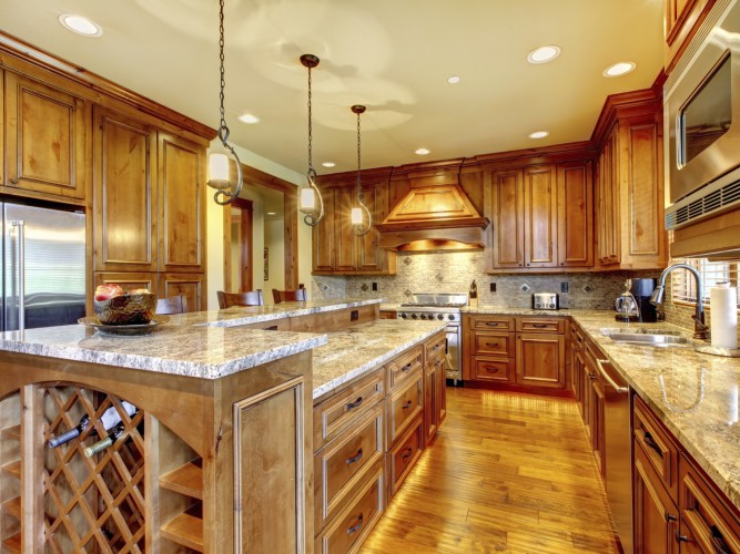 Mountain luxury home with wood kitchen and granite countertop.