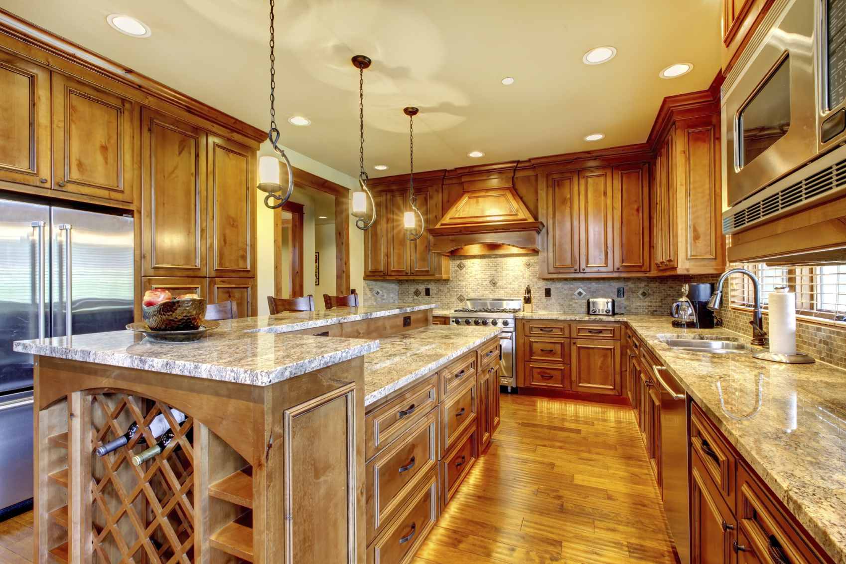 Mountain luxury home with wood kitchen and granite countertop.
