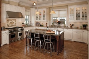 Custom kitchen cabinetry in crisp whites and warm wood tones